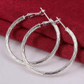 Diamond Cut Hoop Earrings In White Gold